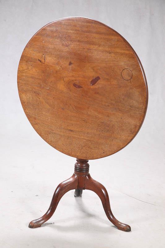 Appraisal: TILT TOP TABLE Walnut with a turned base on padded