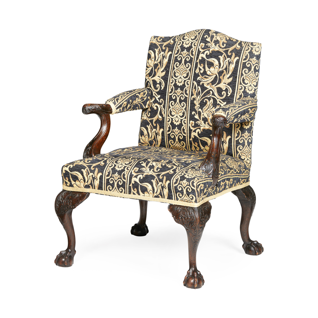 Appraisal: IRISH GEORGE II STYLE OAK ARMCHAIR TH CENTURY the arched