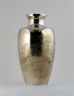 Appraisal: A Japanese silver coloured metal baluster vase engraved with a