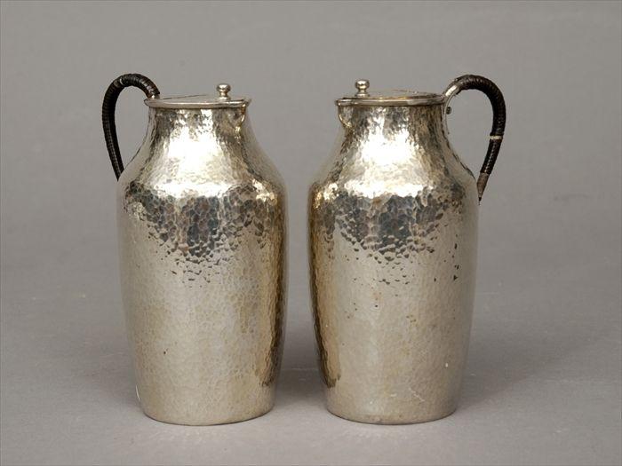 Appraisal: Pair of Chinese Hammered Silver Sauce Jugs with Raffia Handles