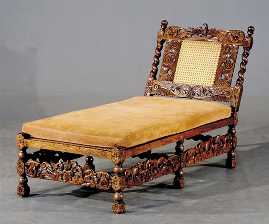 Appraisal: Jacobean carved oak and cane chaise lounge th th centurycanted