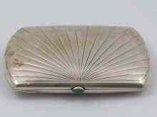 Appraisal: A Russian silver cigarette case rectangular with curved ends cabochon