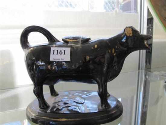 Appraisal: VICTORIAN STAFFORDSHIRE COW CREAMER LOSS TO EAR