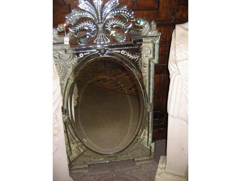 Appraisal: VENETIAN WALL MIRROR With scrolling foliate crest atop the geometric