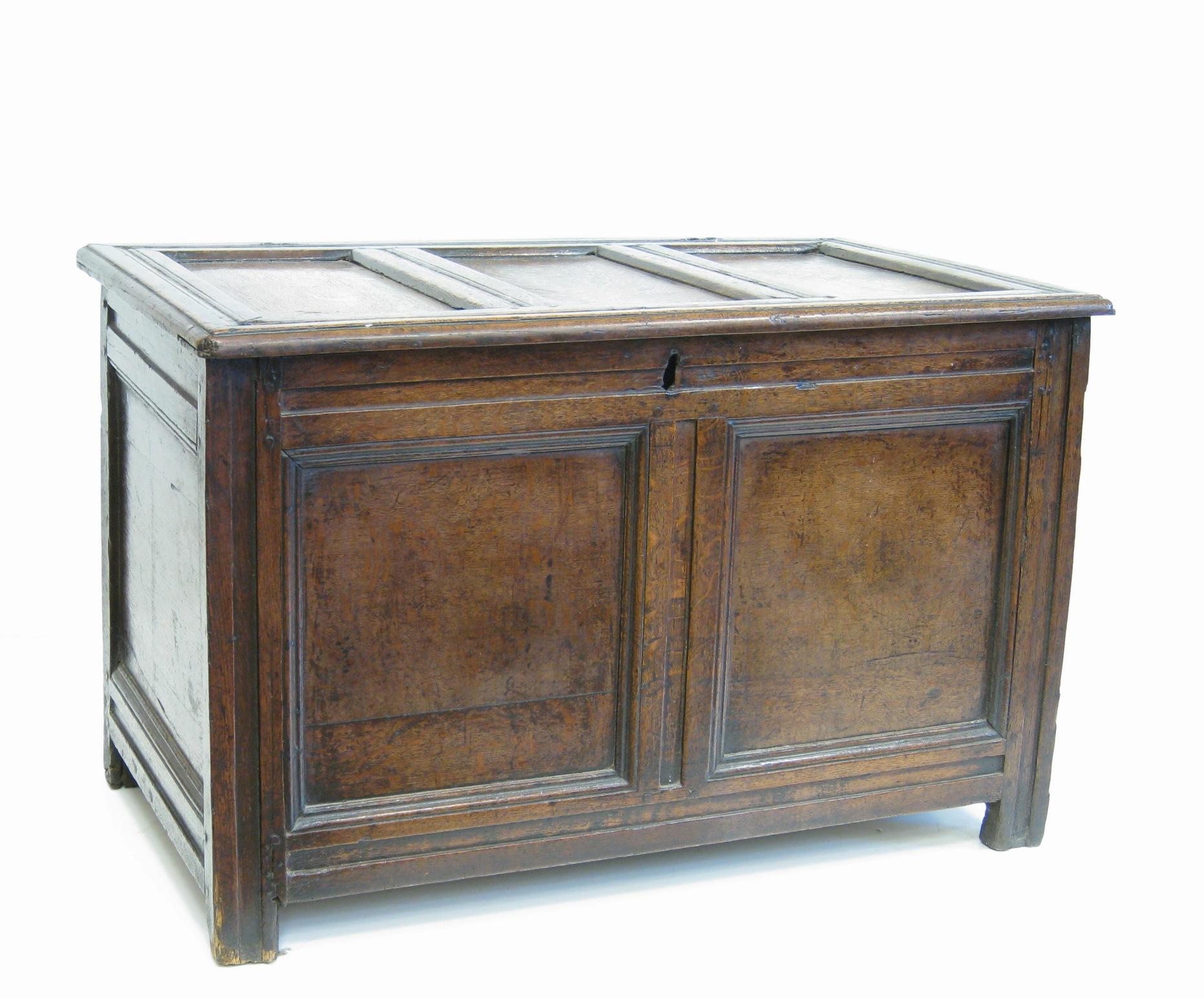 Appraisal: An antique oak Coffer with three panel lid above plain