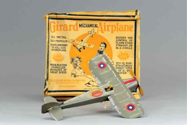 Appraisal: GIRARD MARX MONOPLANE Partial box included lithographed tin seated pilot