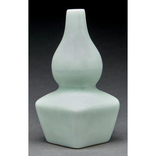 Appraisal: A Chinese pale green monochrome double gourd vase cm h