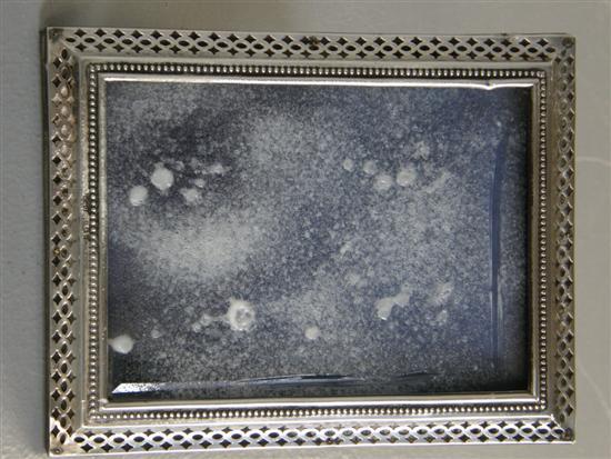 Appraisal: Victorian silver strut rectangular photograph frame with beaded and pierced