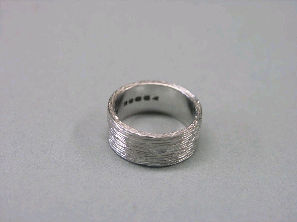 Appraisal: An ct white gold ring bark effect grams ring size