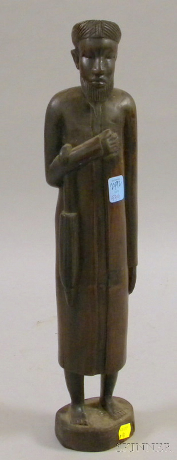 Appraisal: African Carved Wood Sculpture of a Man with a Long