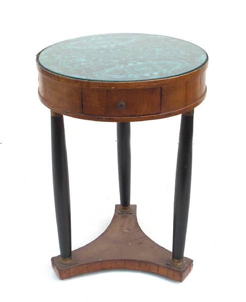 Appraisal: A pair of Empire style parcel ebonized circular side tables