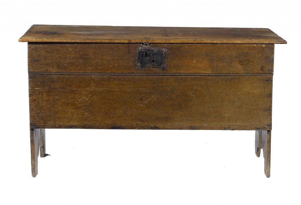 Appraisal: AN ENGLISH BOARDED OAK CHEST with moulded lid and iron