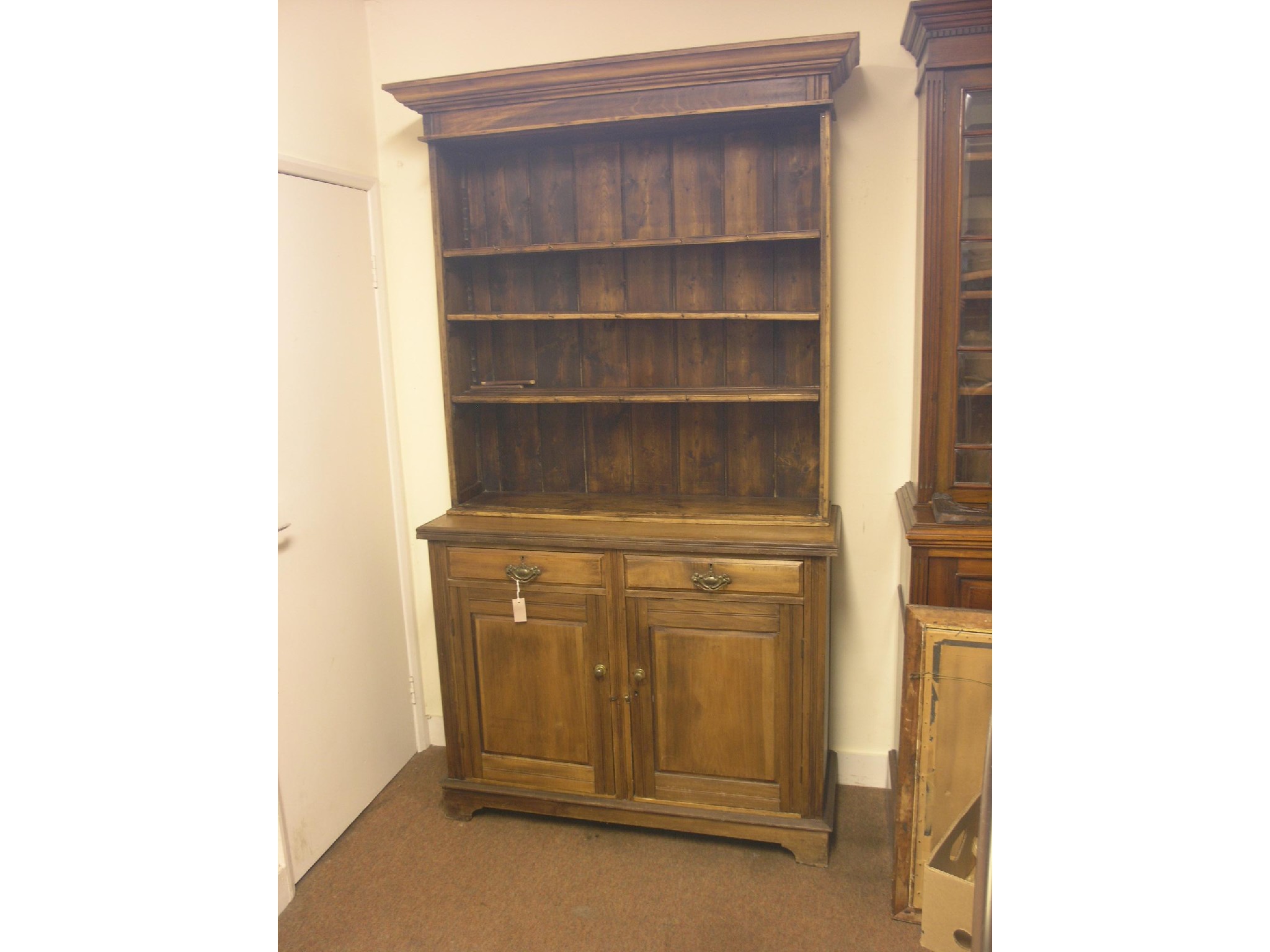 Appraisal: A late Victorian beech dresser three-shelf plate rack above panelled