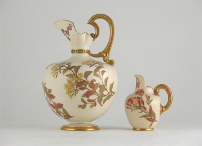 Appraisal: Two Royal Worcester jugs decorated with flowers on an ivory