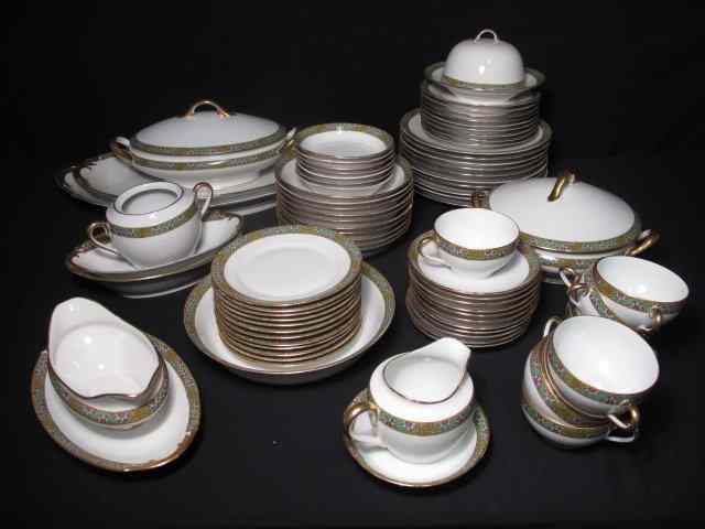 Appraisal: Superieur Limoges ''Triomphe'' porcelain dinnerware set Floral and geometric decorated