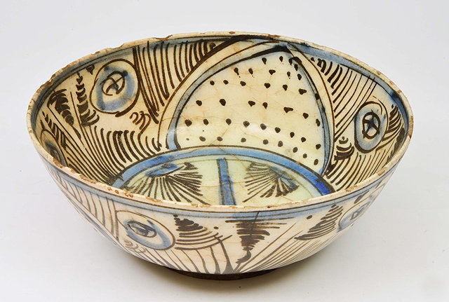 Appraisal: A PERSIAN POTTERY BOWL decorated with white glaze and blue