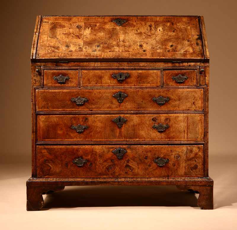 Appraisal: A George II feather-banded walnut and burr walnut slant front