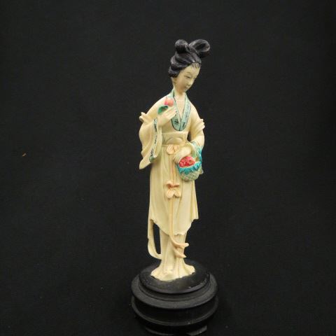 Appraisal: Carved Ivory Figurine of a Chinese Lady fancy polychrome trim