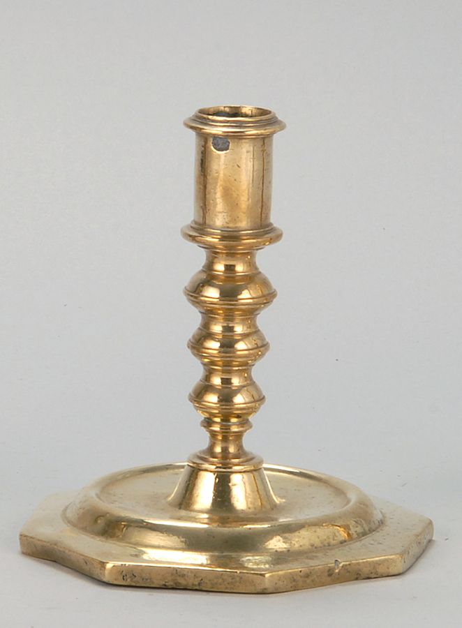 Appraisal: ANTIQUE QUEEN ANNE BRASS CANDLESTICK th CenturyWith hexagonal foot Height