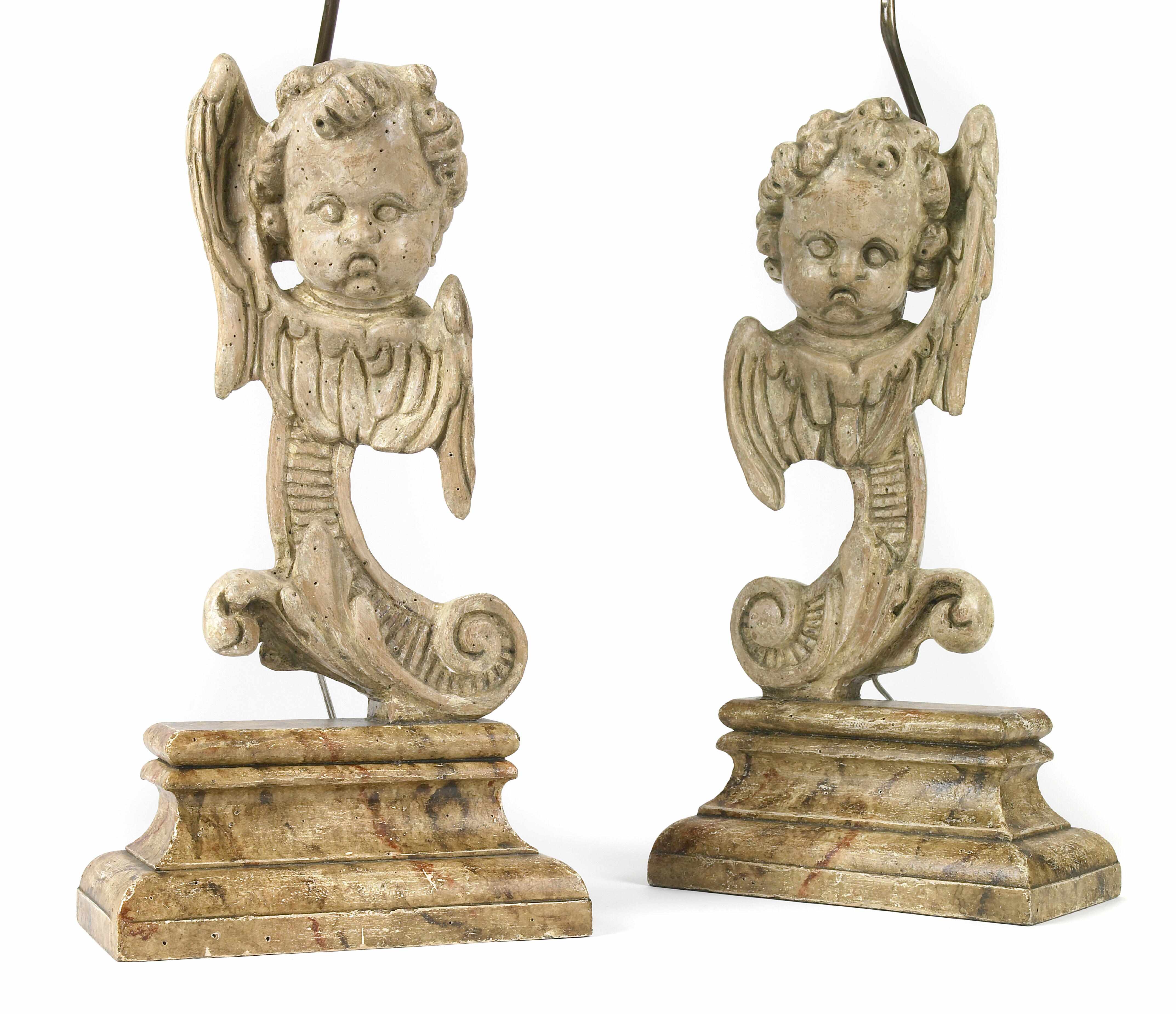 Appraisal: A pair of Continental Rococo style paint decorated wood seraphim