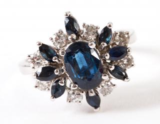 Appraisal: K white gold natural dark blue sapphire and diamond cluster