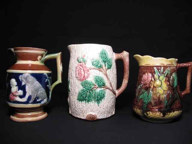 Appraisal: Lot of three Majolica pottery pitchers Includes with with a