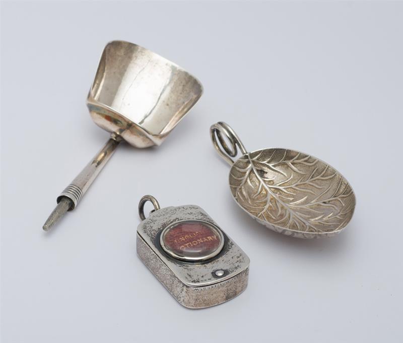 Appraisal: TWO GEORGE III SILVER CADDY SPOONS AND AN ENGLISH MINIATURE