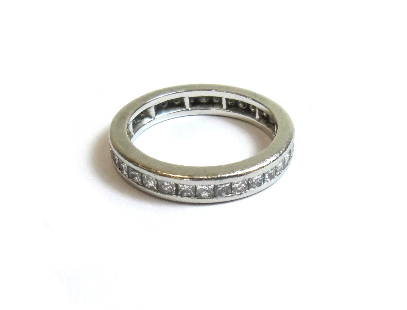 Appraisal: A diamond set full eternity ring mounted with princess cut