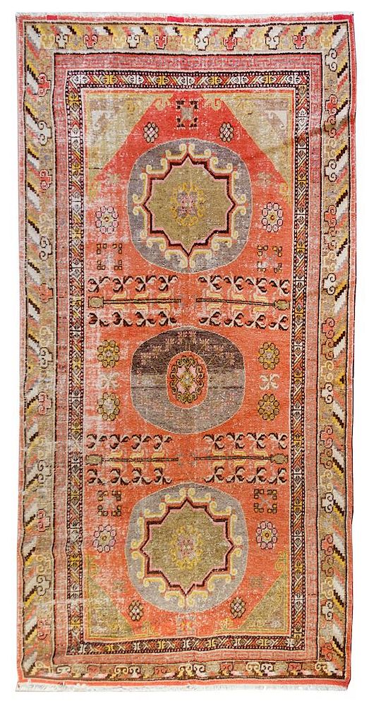 Appraisal: A Khotan Wool Rug feet x feet inches A Khotan