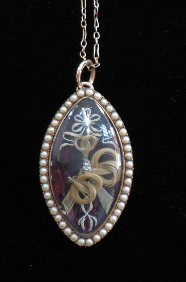 Appraisal: A GEORGE III NAVETTE-SHAPED PENDANT the purple guilloche enamel ground