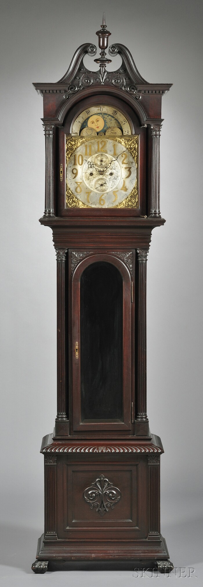 Appraisal: Mahogany Hall Clock Germany c with scroll top hood carved