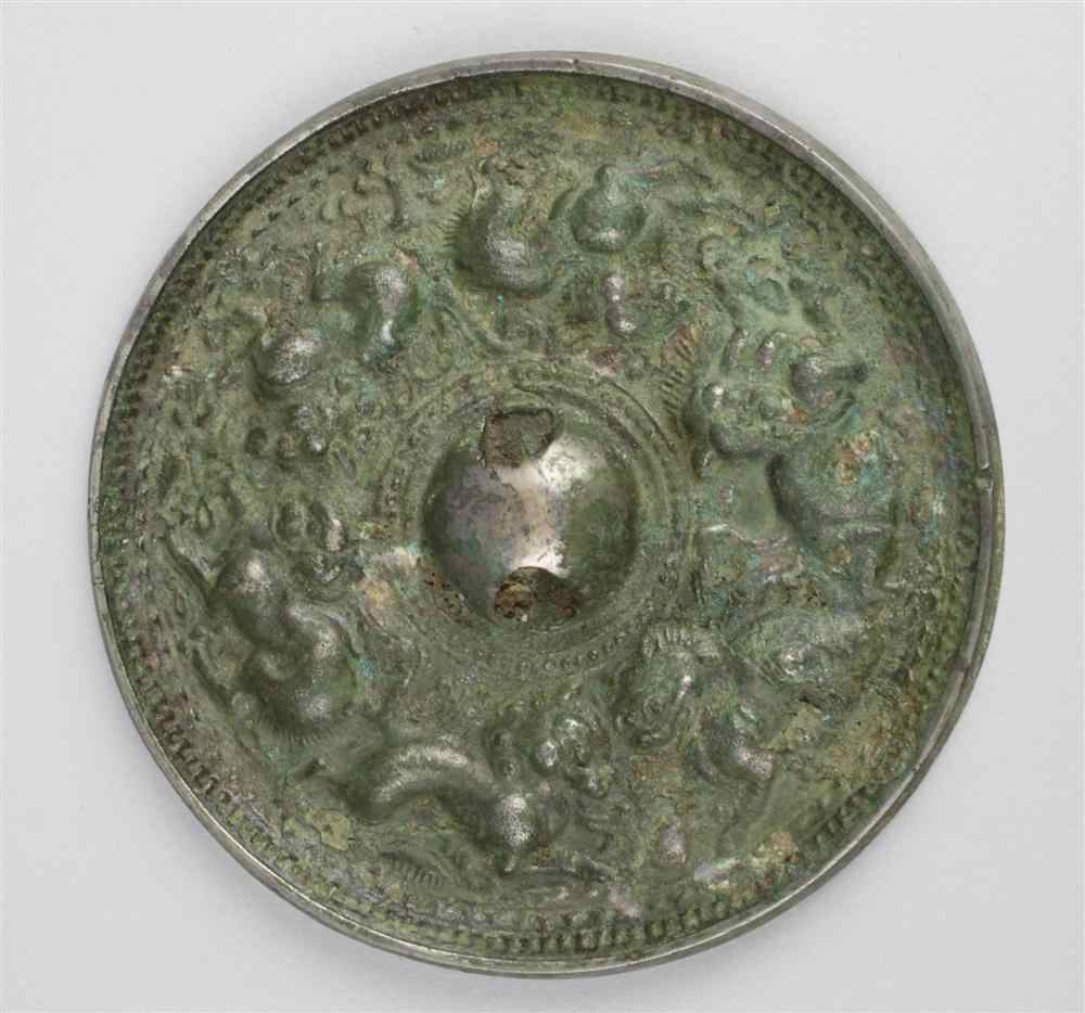 Appraisal: CHINESE SILVERED BRONZE CIRCULAR MIRROR TANG DYNASTY well cast with