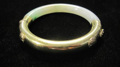 Appraisal: karat yellow gold and jade bangleHalf of bangle covered in