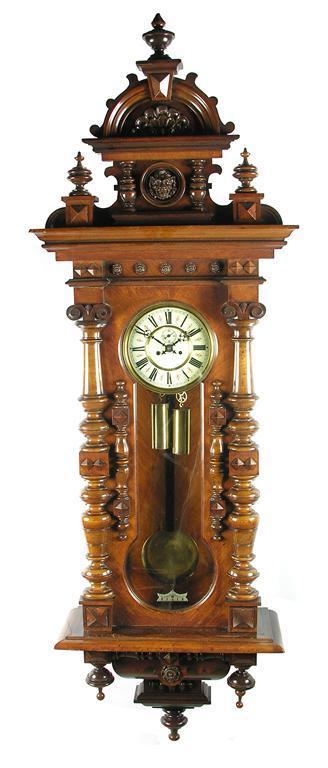 Appraisal: A walnut Vienna regulator wall clock