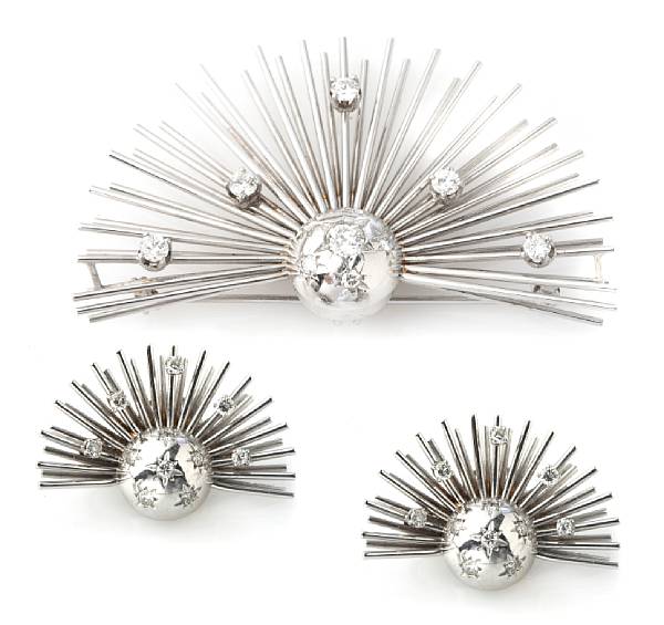 Appraisal: A diamond gold and rhodium spray brooch together with a