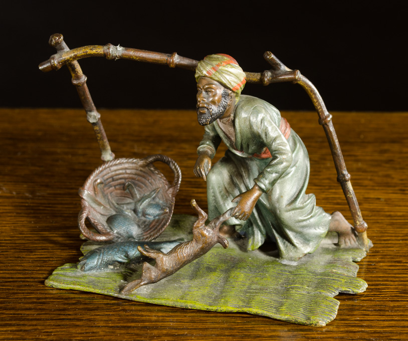 Appraisal: AUSTRIAN COLD PAINTED BRONZE SCULPTURE Arab peddler on mat with