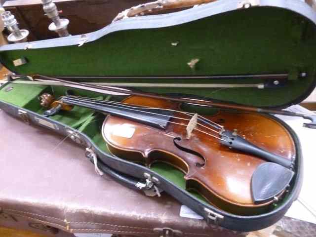 Appraisal: A SMALL SIZE VIOLIN back long together with two bows