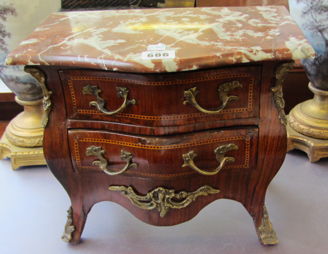 Appraisal: A French miniature bombe shaped marble topped tulipwood and marquetry