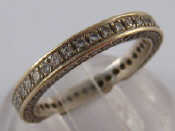 Appraisal: A white metal tests carat gold diamond eternity ring with