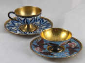 Appraisal: Two Soviet Russian cloisonne enamelled silver gilt cups and saucers