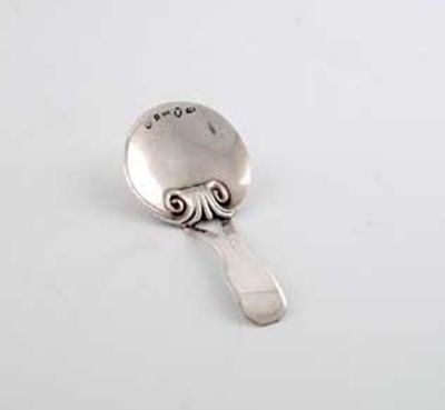 Appraisal: A George III caddy spoon with a bifurcated stem and