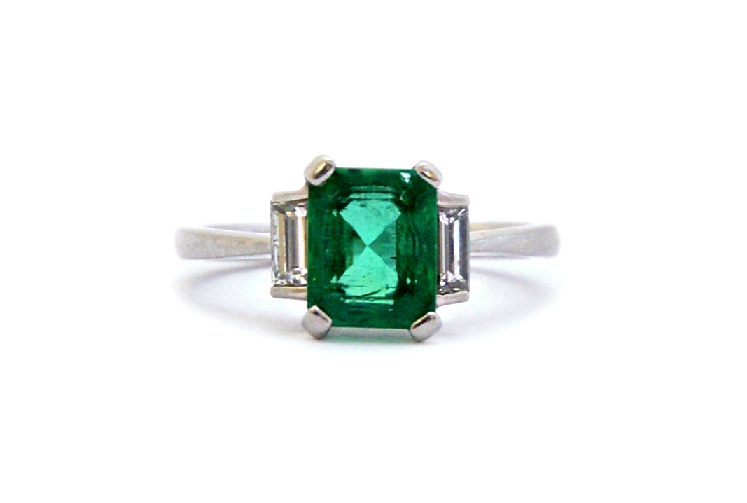 Appraisal: A platinum emerald and diamond set ring claw set with