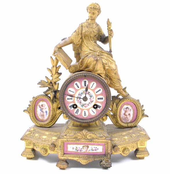 Appraisal: A French gilt metal and porcelain mounted figural mantel clock