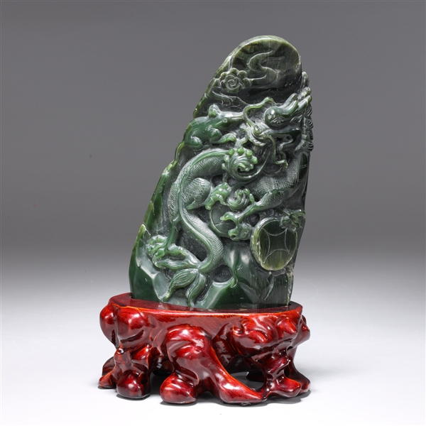 Appraisal: Chinese spinach jade carving of triangular mountain with a intricately