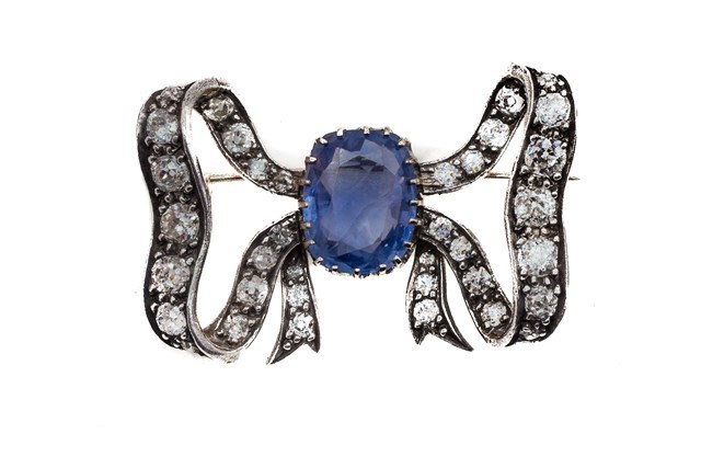 Appraisal: A Ceylon sapphire and diamond set brooch designed as a