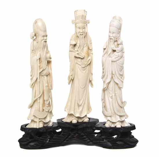 Appraisal: A Group of Three Ivory Carvings of Immortals each with