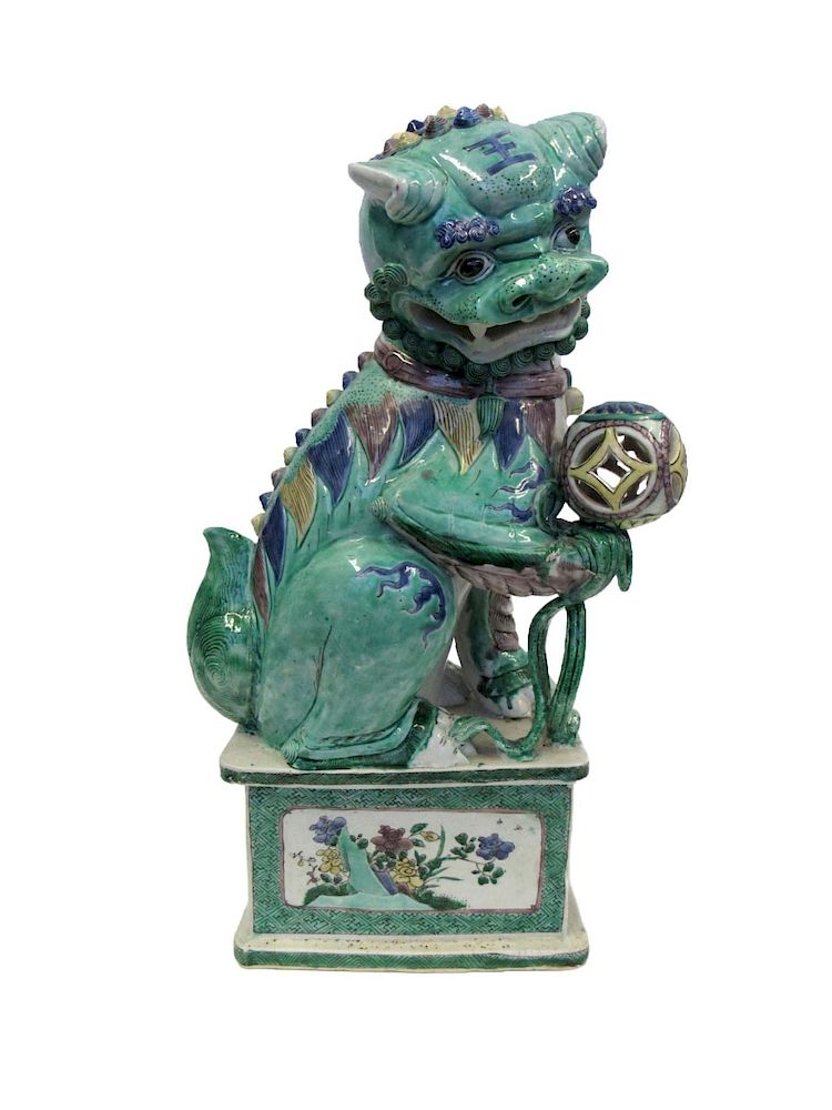 Appraisal: Famille Verte Biscuit Buddhist Lion The creature crouches balancing a