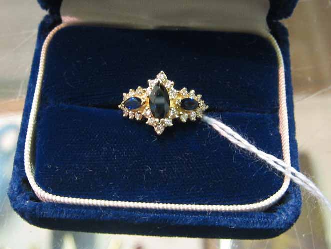 Appraisal: SAPPHIRE DIAMOND AND FOURTEEN KARAT GOLD RING set with three