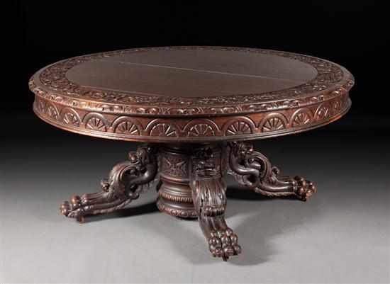 Appraisal: Jacobean Revival carved oak split-pedestal round dining table with four