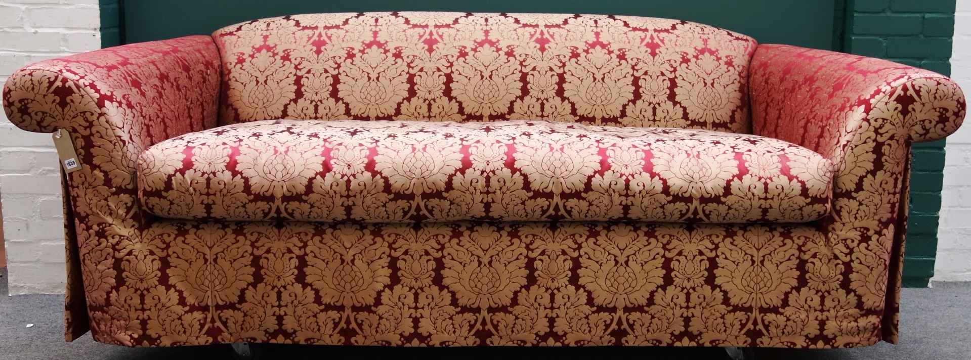 Appraisal: A th century red and golden thistle upholstered sofa on